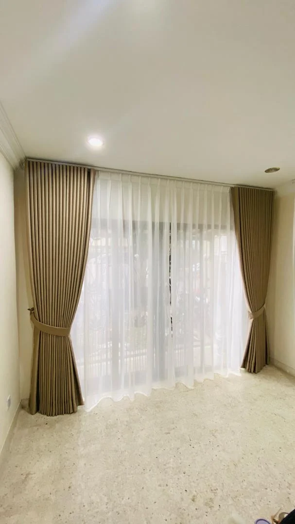 Light grey corner window curtains by Alam Enterprises